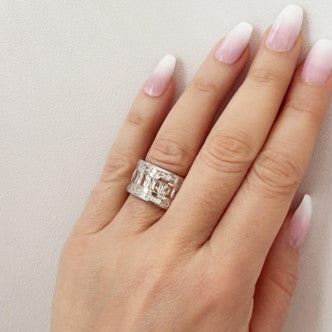 Champagne Baguette Ring is crafted of 925 sterling silver and features champagne and clear baguette-cut cubic zirconia stones that wrap around your finger. Worldwide shipping.