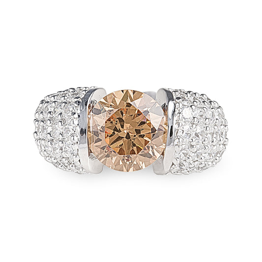 Deep Sun Ring in 925 sterling silver features a 3-carat facet cut champagne cubic zirconia stone surrounded by clear cubic zirconia stones. Worldwide shipping. Jewellery by Bellagio & Co.