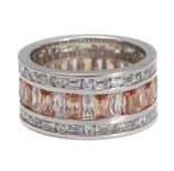 Champagne Baguette Ring is crafted of 925 sterling silver and features champagne and clear baguette-cut cubic zirconia stones that wrap around your finger. Worldwide shipping.