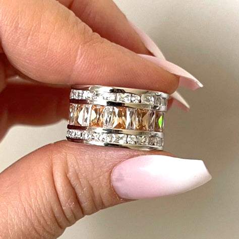  Champagne Baguette Ring is crafted of 925 sterling silver and features champagne and clear baguette-cut cubic zirconia stones that wrap around your finger. Worldwide shipping.
