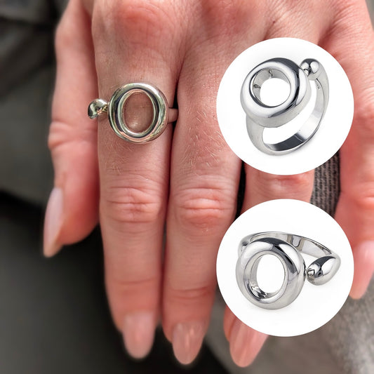 The Lana Ring by Bellagio & Co. Close-up of a hand wearing a 925 sterling silver ring  with a unique circular design. Shop online. Worldwide shipping.