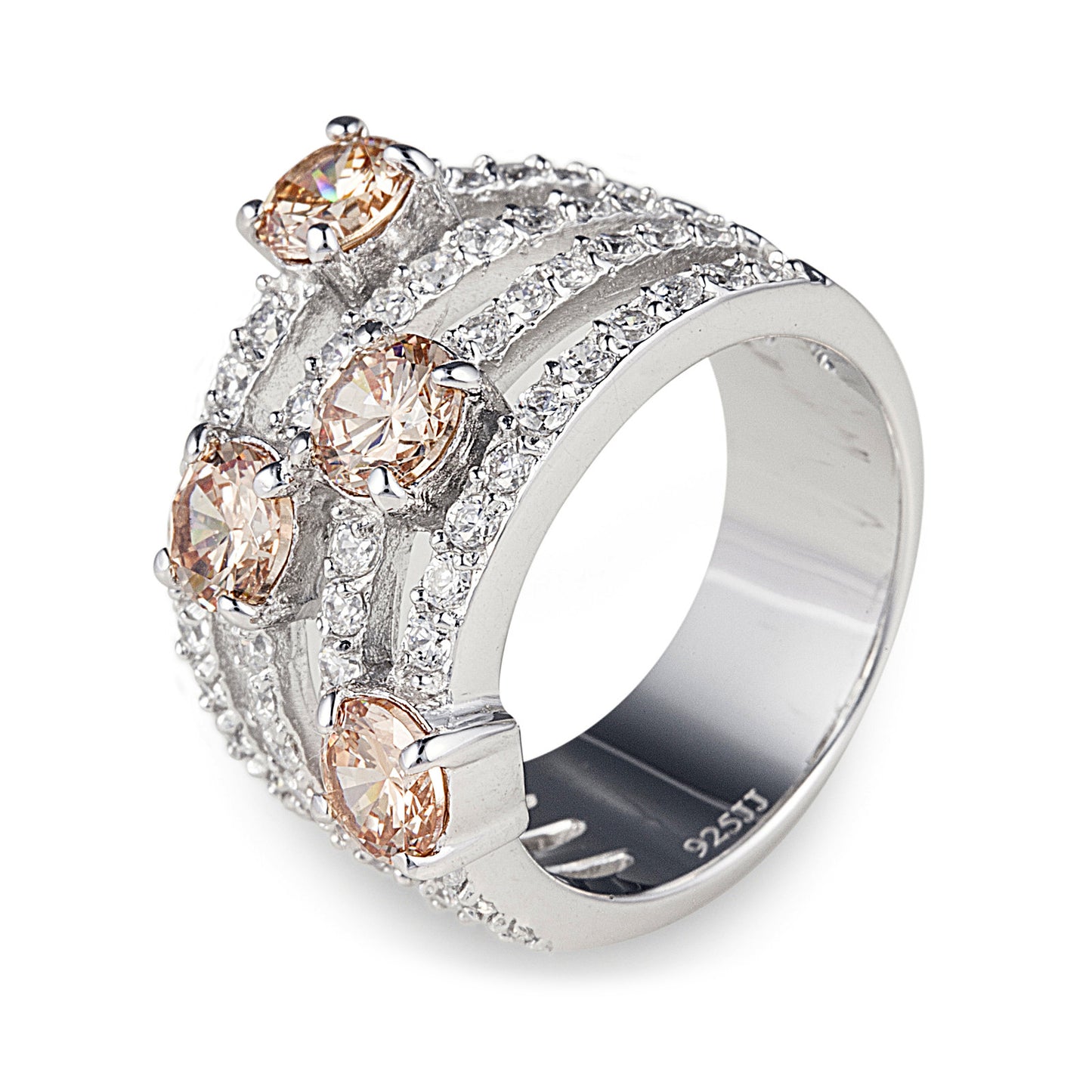 Royal Corona Ring is a gorgeous multi-layered 925 sterling silver ring featuring rows of clear cubic zirconia stones with four scattered champagne cubic zirconia stones. Worldwide shipping. Affordable luxury jewellery by Bellagio & Co.