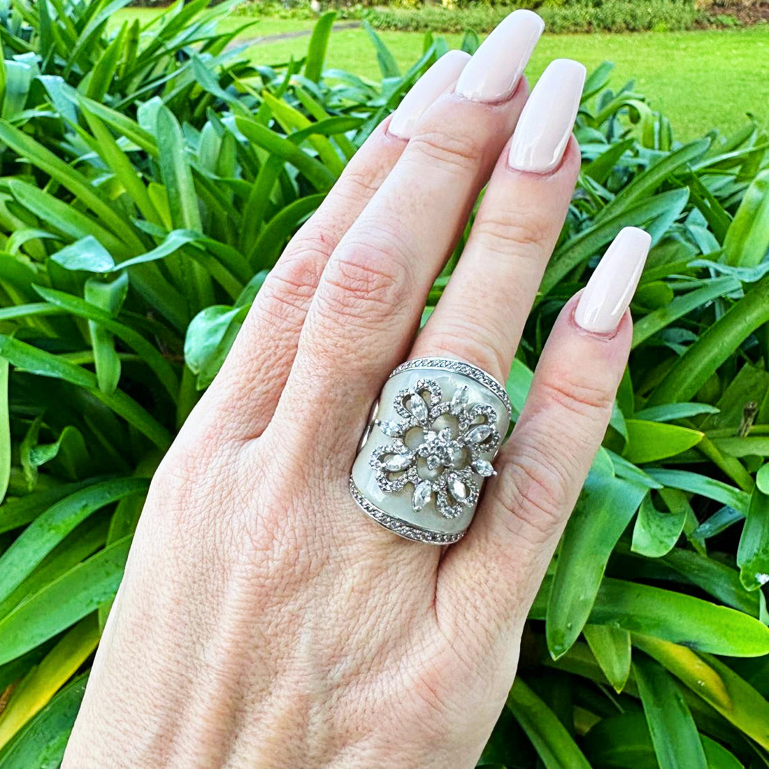 Tuscan Sun Ring in 925 Sterling Silver with polished Mother of Pearl & Cubic Zirconia stones in a sun design. Worldwide shipping with FREE shipping within Australia. Affordable luxury jewellery by Bellagio & Co.