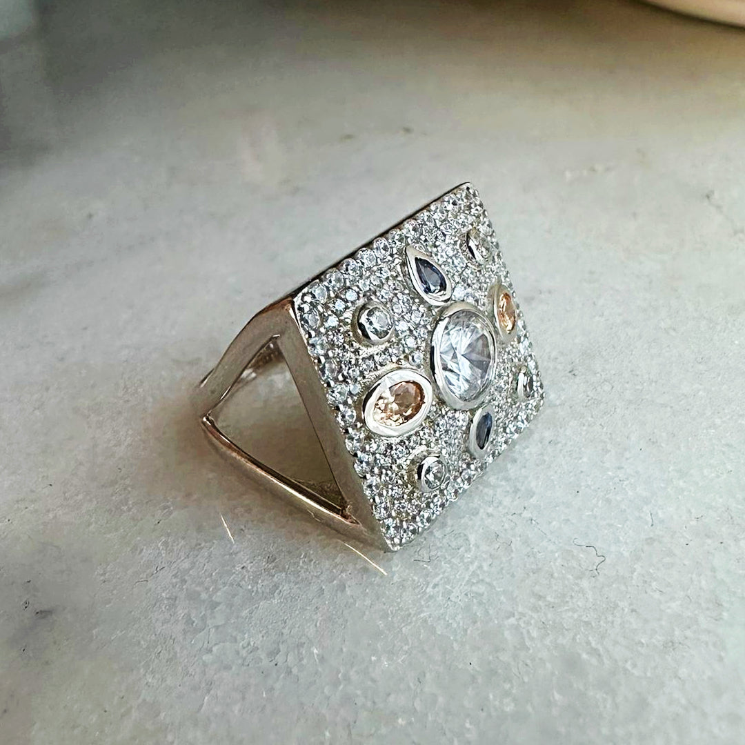 Antique Pillow Ring in 925 sterling silver with a geometric design, sparkling clear, champagne and blue topaz cubic zirconia stones. Worldwide shipping from Australia