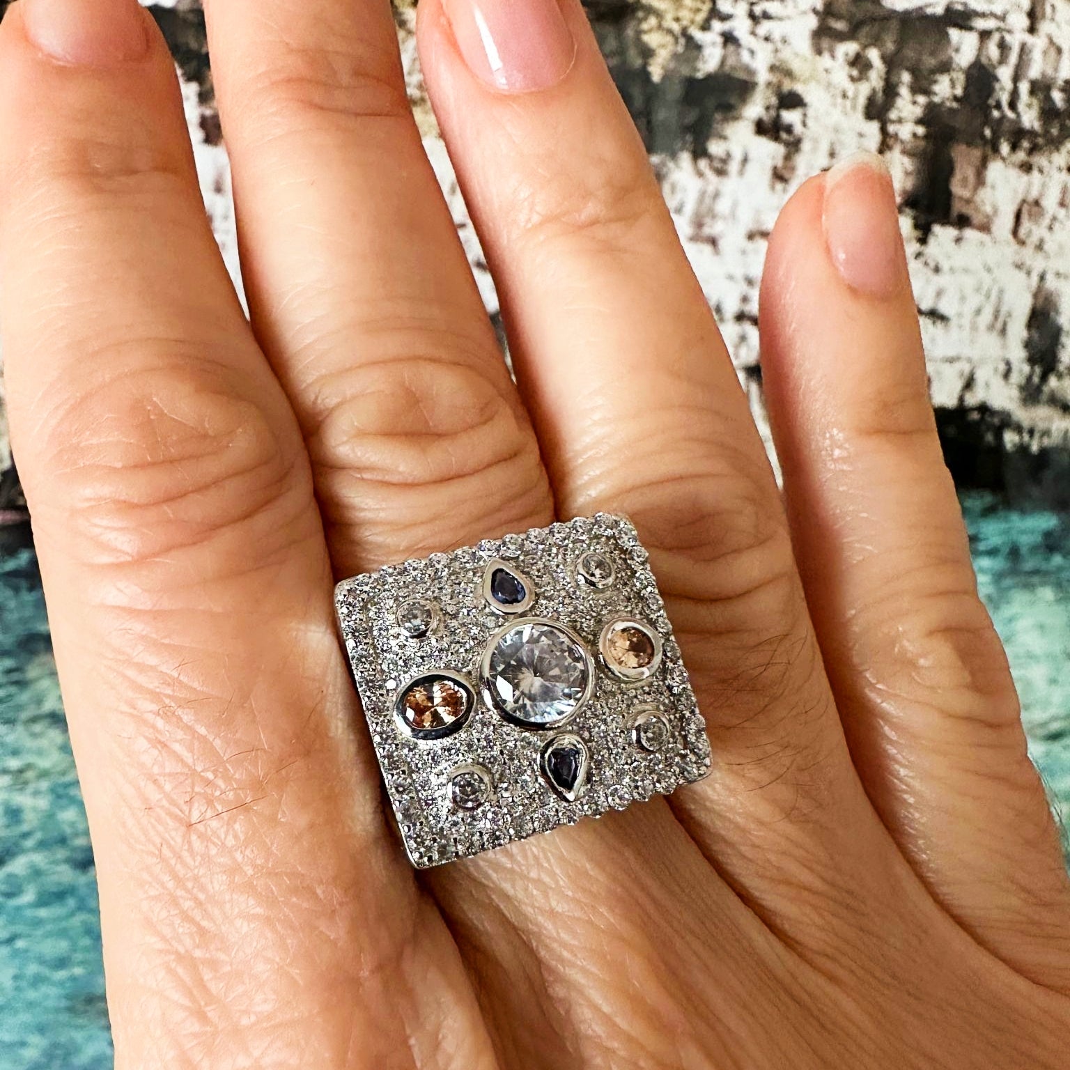 Antique Pillow Ring in 925 sterling silver with a geometric design, sparkling clear, champagne and blue topaz cubic zirconia stones. Worldwide shipping from Australia