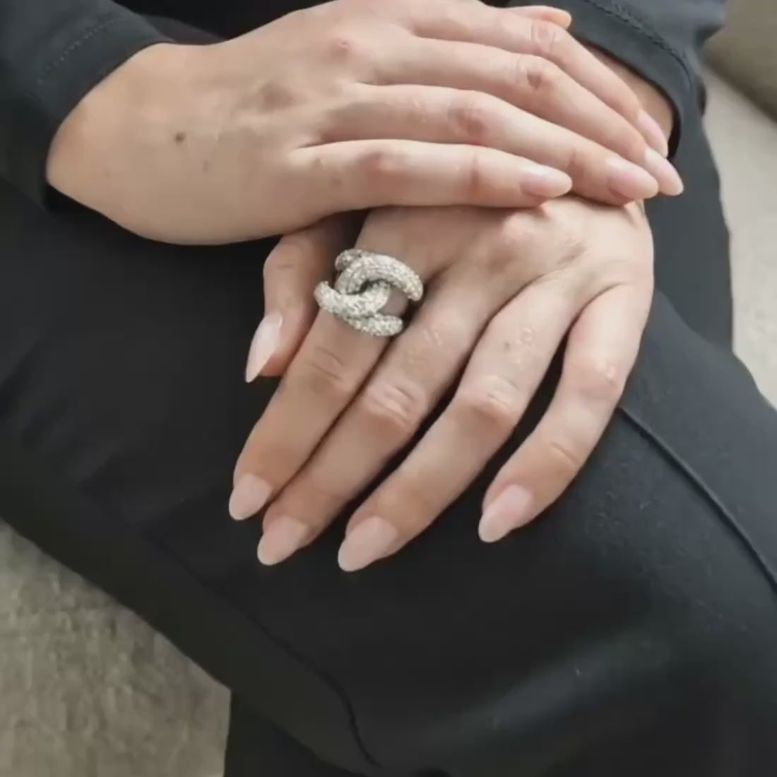 White Snow Coco Ring in 925 sterling silver features an overlapping knot design encrusted with cubic zirconia stones. Worldwide shipping from Australia. Affordable luxury jewellery by Bellagio & Co.