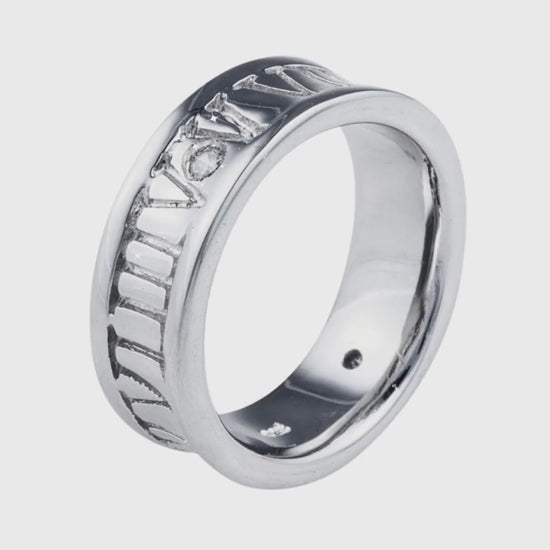 Ceasar Band Ring in 925 sterling silver with a single Cubic Zirconia stone surrounded by Roman numerals. This ring is perfect for comfortable everyday wear. Jewellery by Bellagio & Co. Worldwide Shipping.