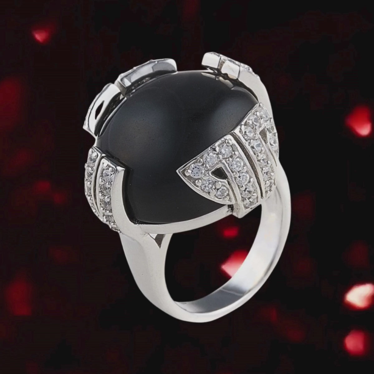Onyx Secret Ring in 925 sterling silver with a polished black onyx stone held in place with geometric claws encrusted with cubic zirconia stones. Shop rings & affordable luxury jewellery by Bellagio & Co. Worldwide shipping