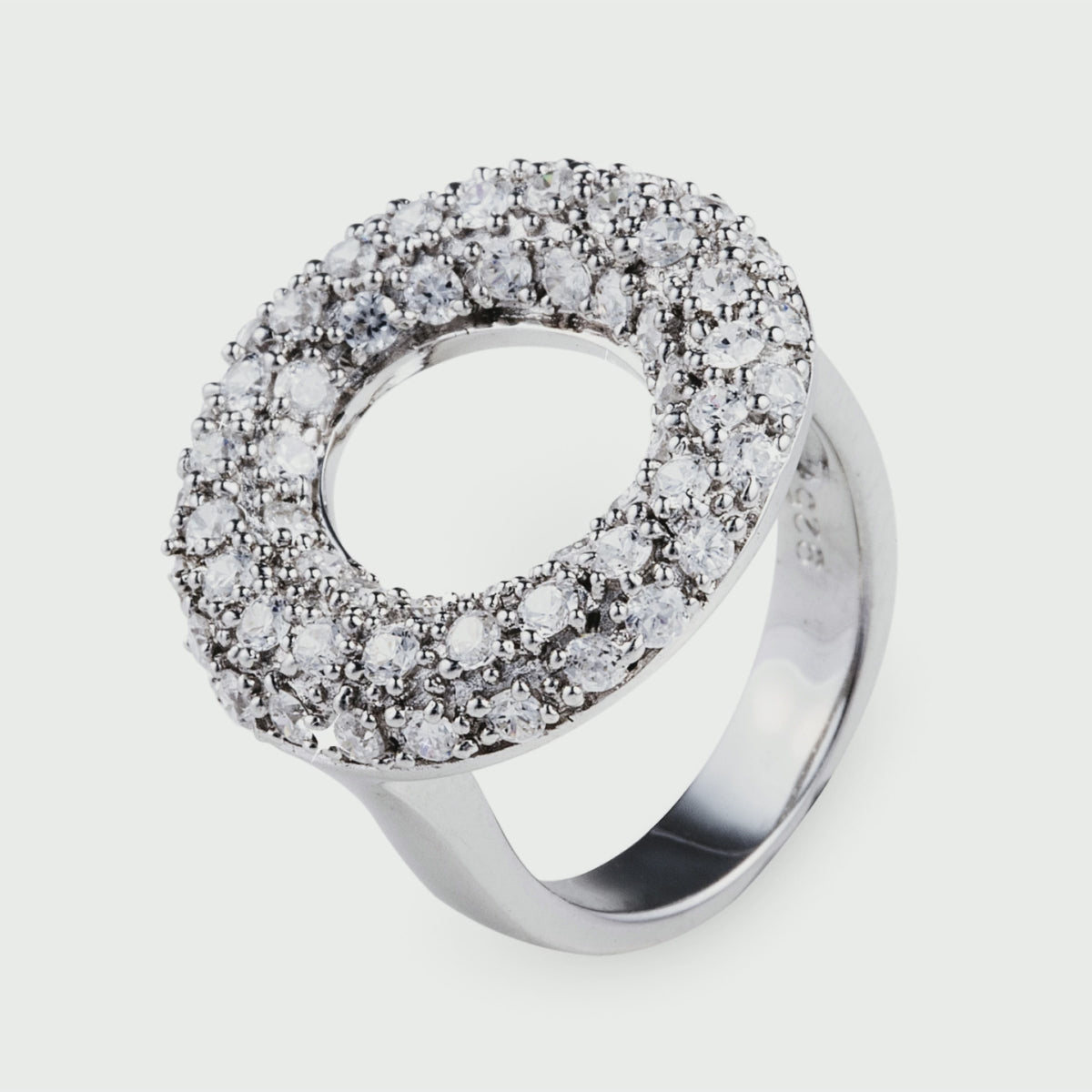 The elegant Sparkly Lana Ring features a classic 'O' shape encrusted with cubic zirconia stones in a pave setting. This beautiful ring is made of 925 sterling silver. Jewellery by Bellagio & Co. Worldwide shipping.